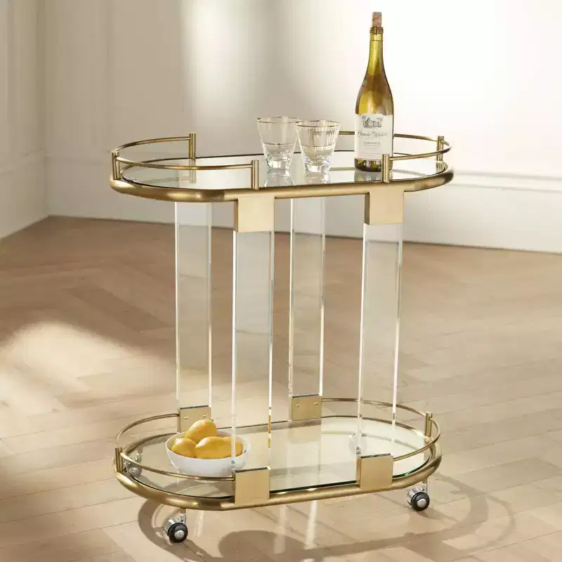 55 Downing Street Adaline 29 1/2 Wide Clear Acrylic and Gold Oval Bar Cart