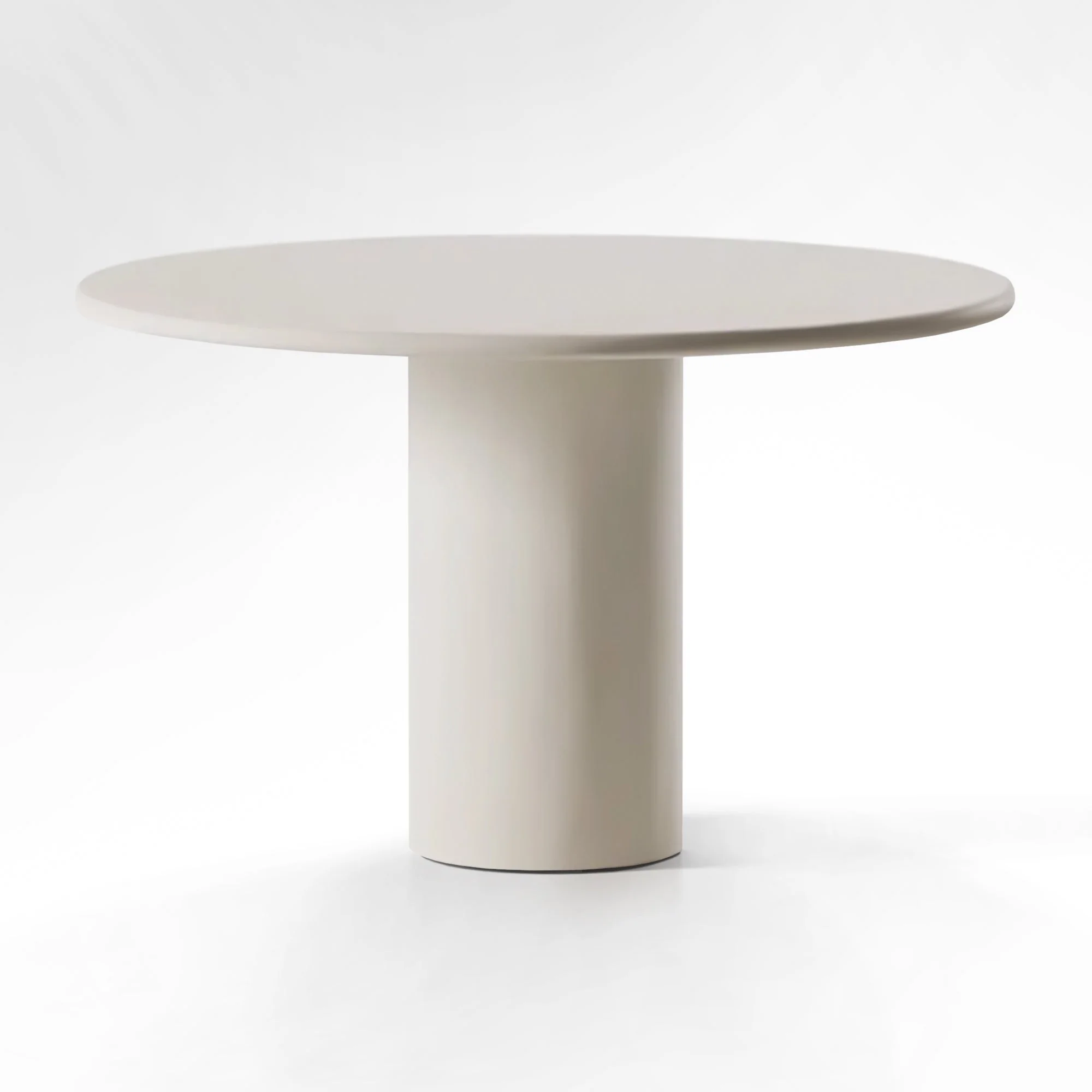 Round Dining Table in Cement - Microcement - sustainable low-density MDF - and a solid spruce wood structure accompanied by a fromager covering for