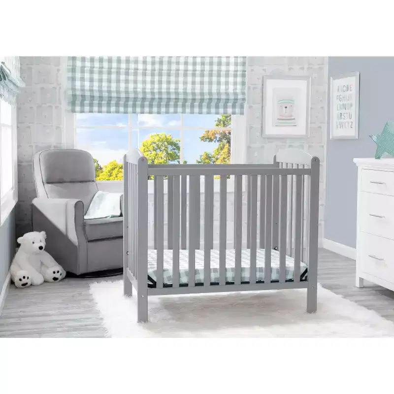 Delta Children Sprout Mini Crib With Adjustable Height and Mattress