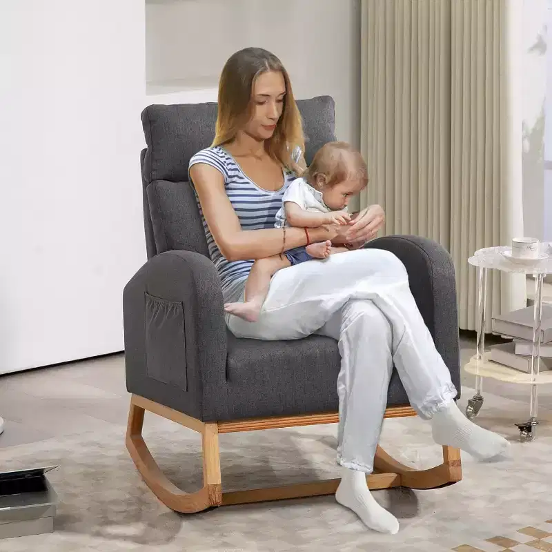 Upholstered Grey Rocking Chair with Wood Base, Padded Backrest, and Side PocketsModern Glider Armchair for Nursery, Living Room, or Bedroom