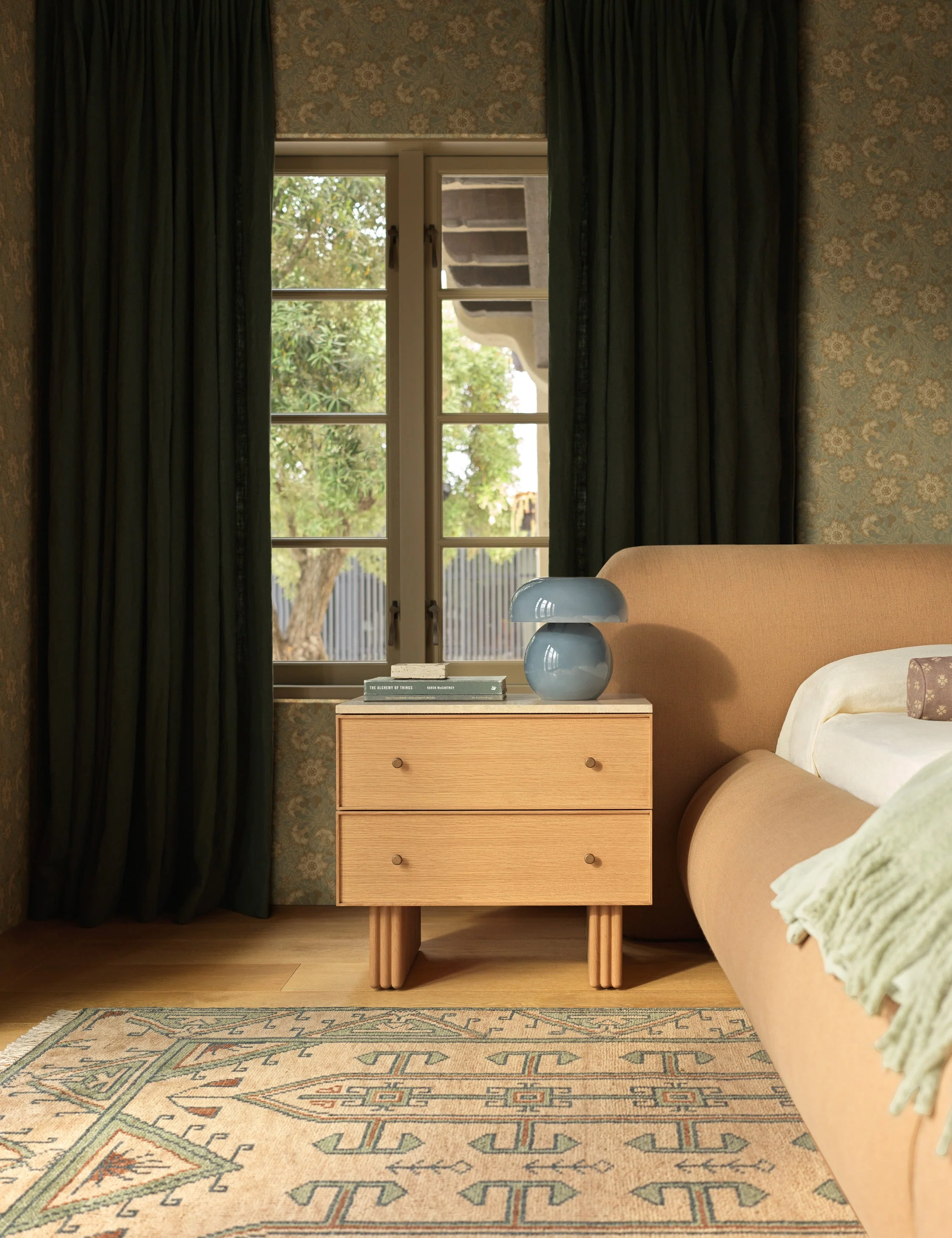 Nightstand A mix of rich materials and thoughtful design define our nightstand. The oak case is topped with natural travertine for a grounded yet