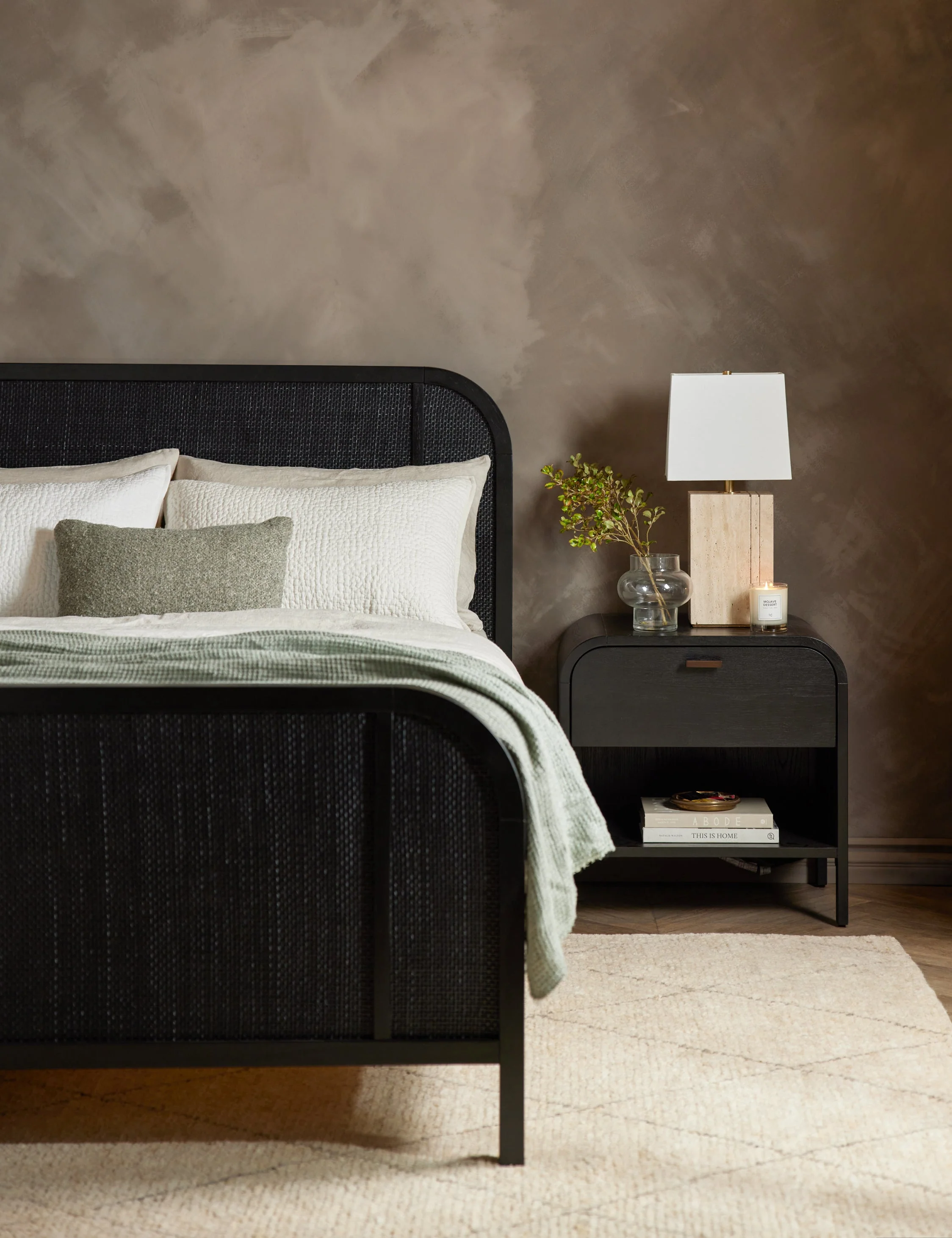 Bed This solid oak bed frame is grounded by curved lines set off by cane paneling at the foot and headboard. A whitewashed finish warmly