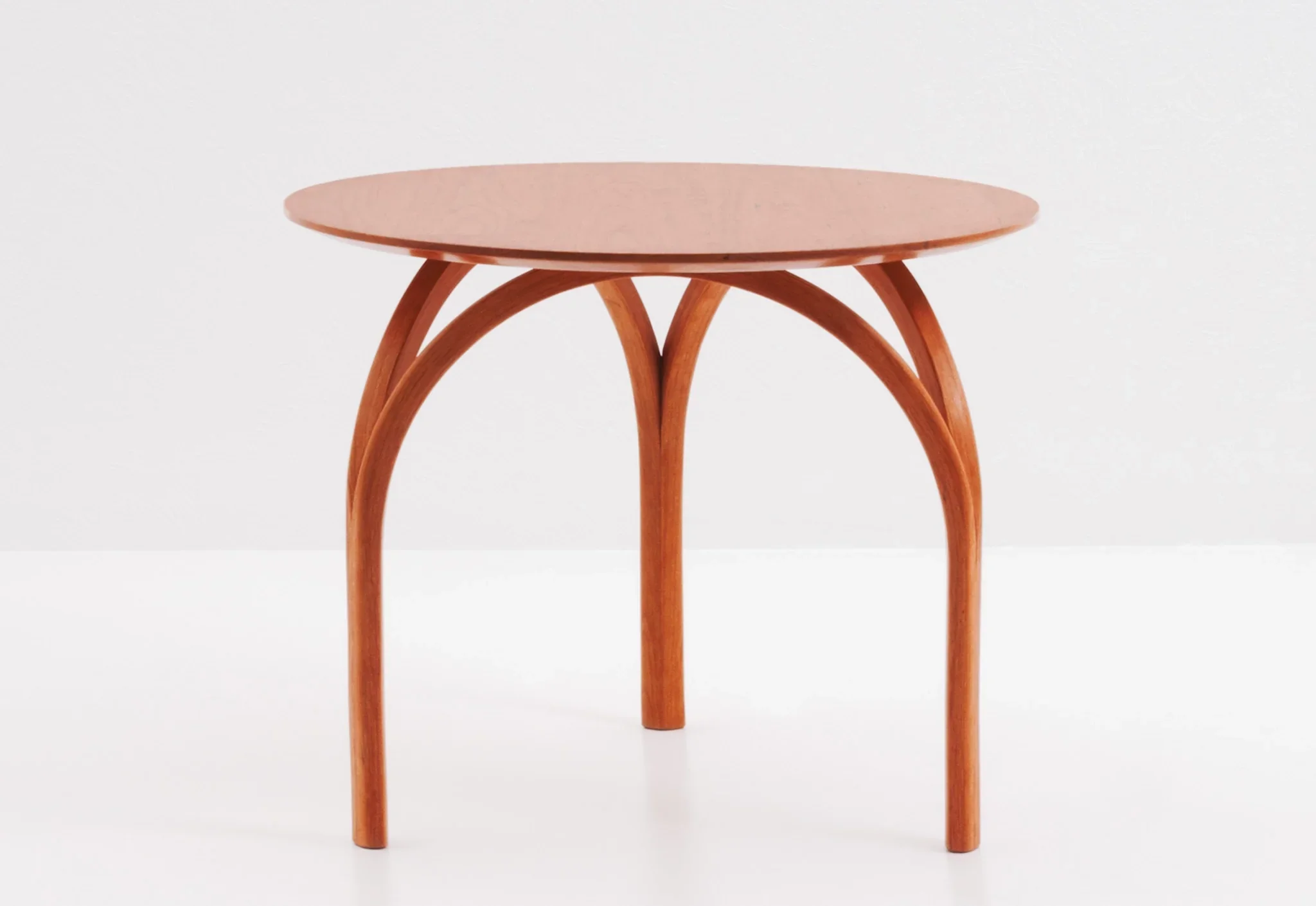 Table - With curved legs that suggest a cathedral's dome or the arch of its stained-glass windows, the is spectacular