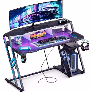 '-48 Inch Gaming Desk with Power Outlet LED Lights Carbon Fiber Texture PC Storage Shelf