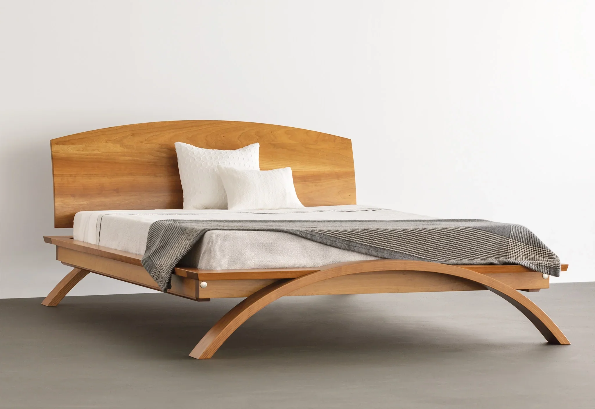 Bed - Taking good design down to the fundamentals, the simplicity and curved headboard harken back to the era, while