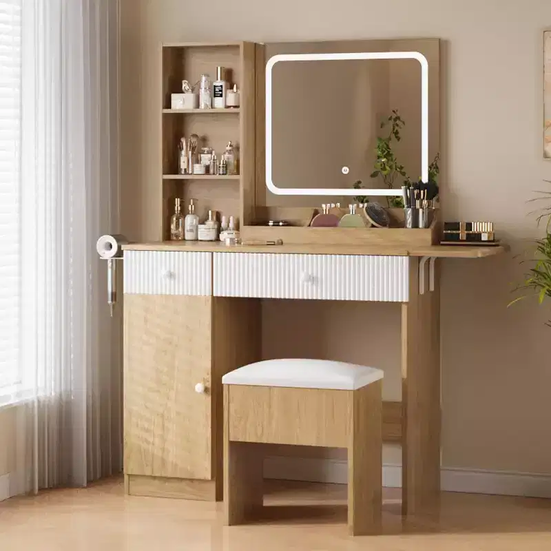 Vanity with mirror and light, featuring drawers and a padded stool, equipped with power outlets, suitable for bedrooms and living rooms.